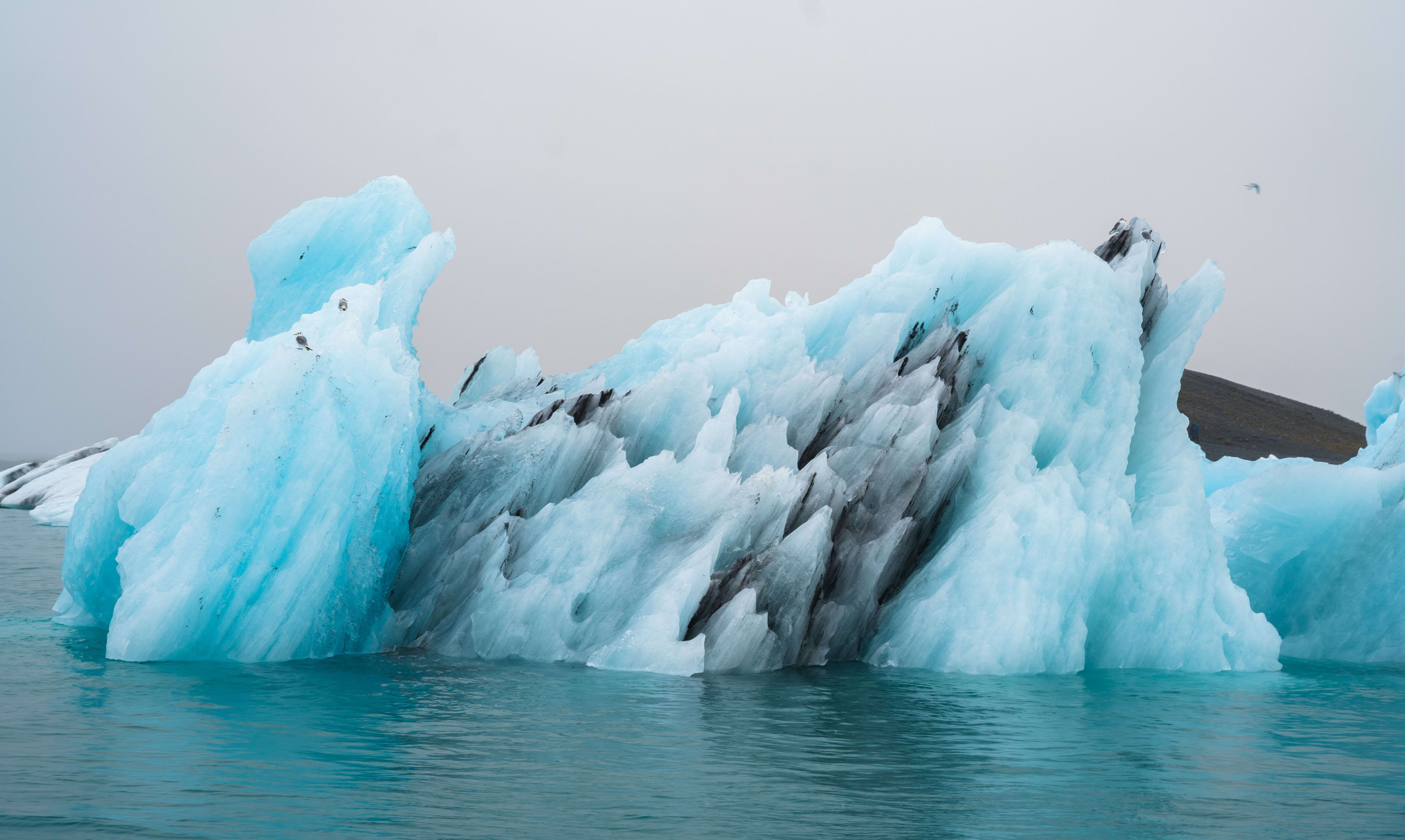 giant blue and black iceberg in jokulsarlon