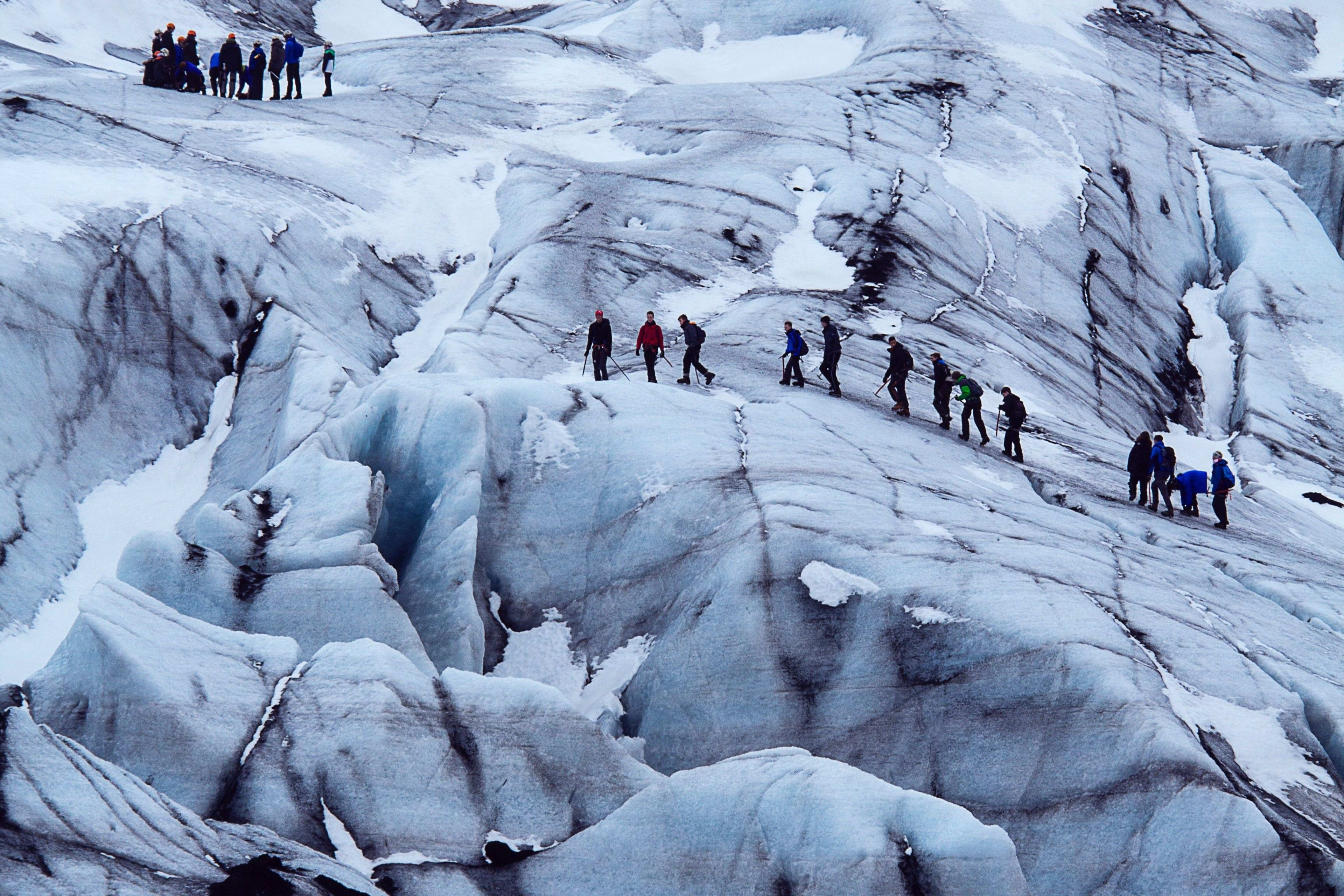 group walking on iceland glacier