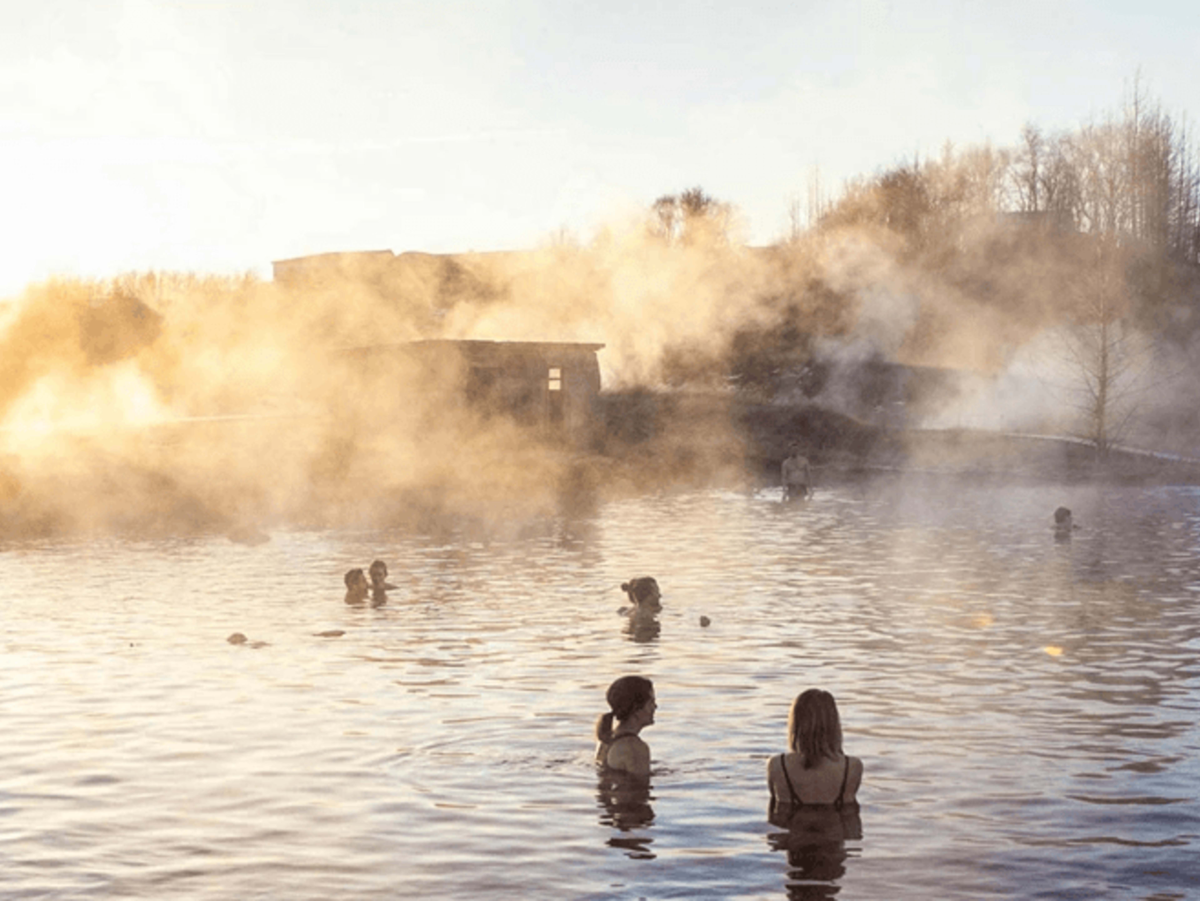 secret lagoon hot spring in iceland at sunset