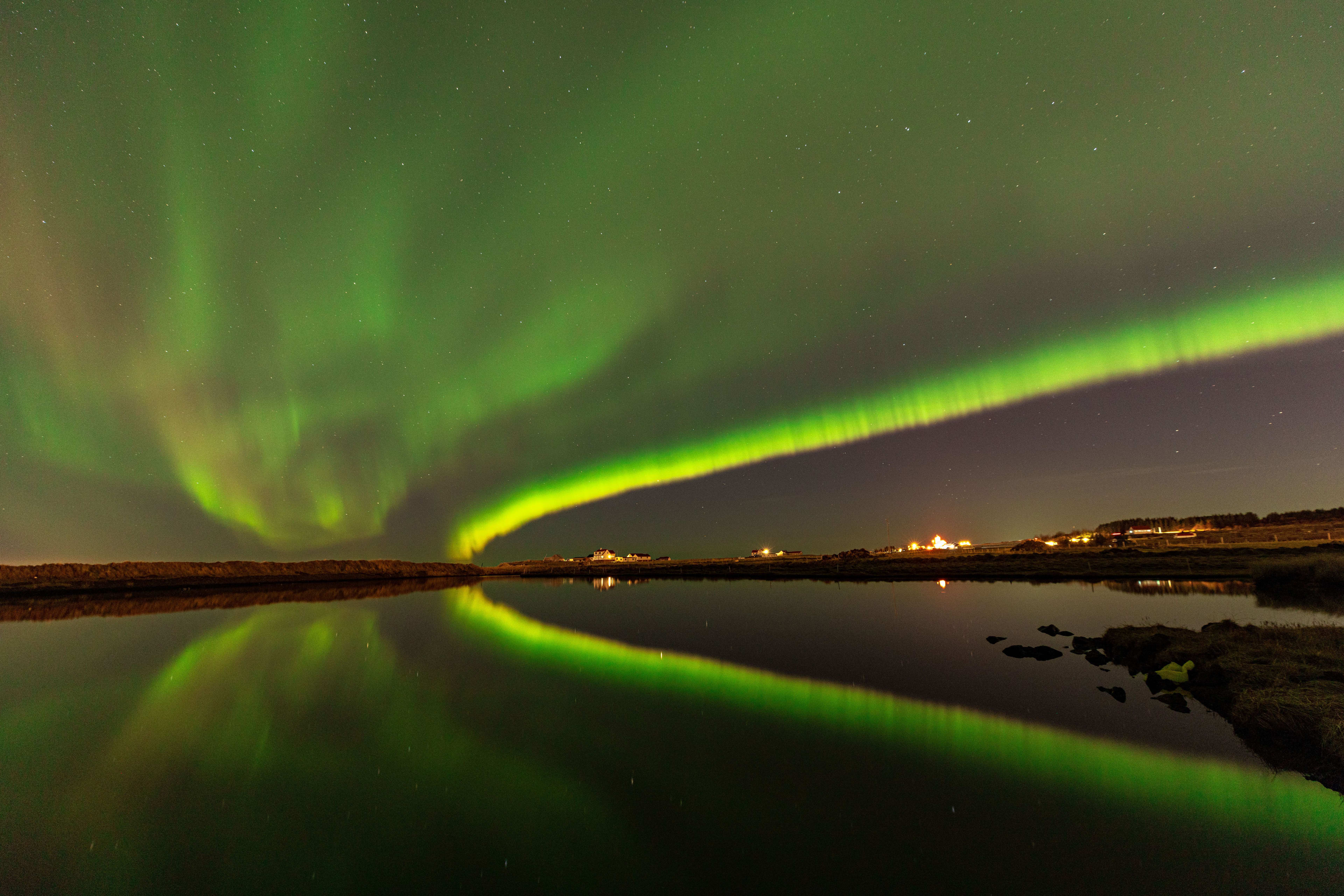 northern lights above lake