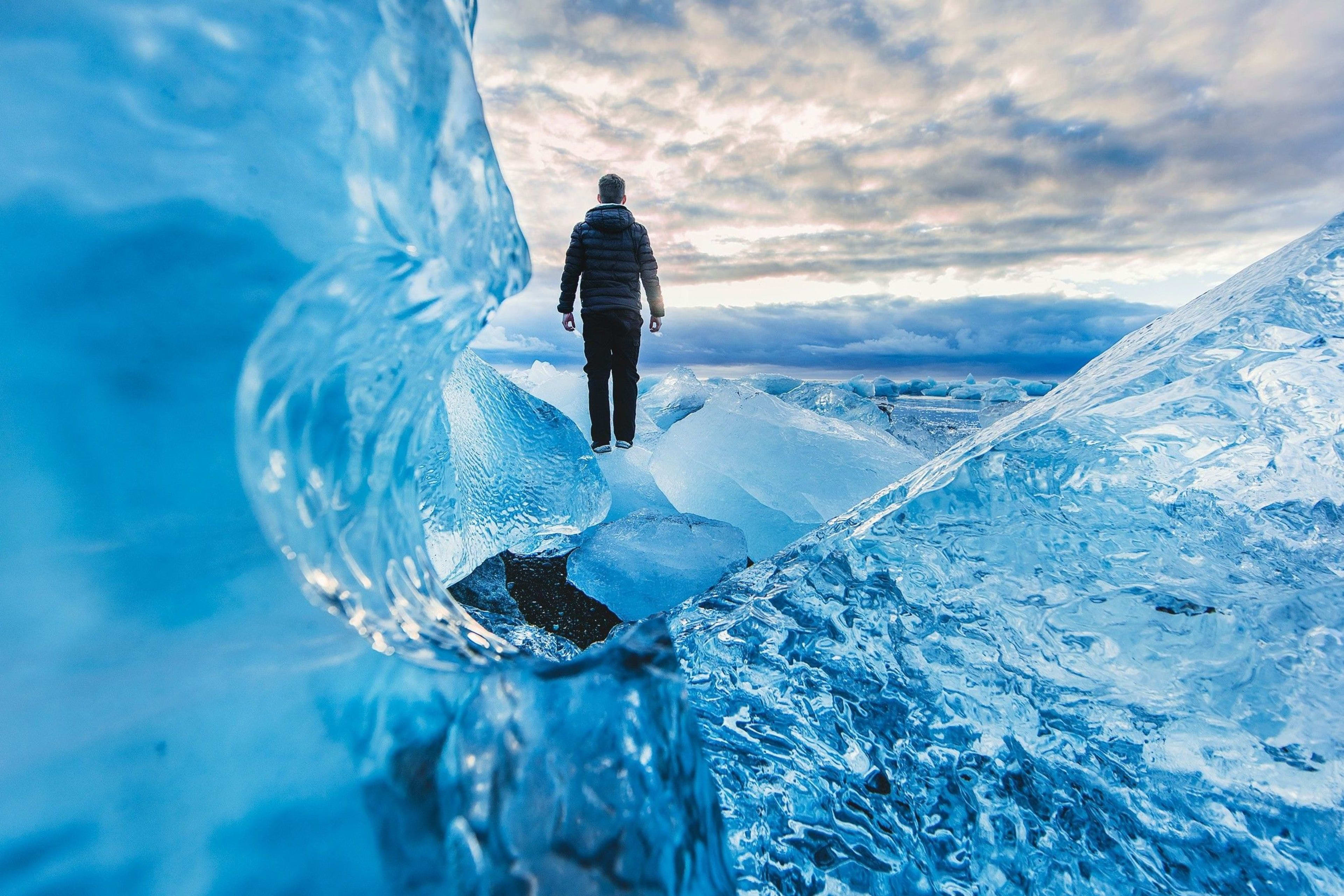 man on the blue ice cave