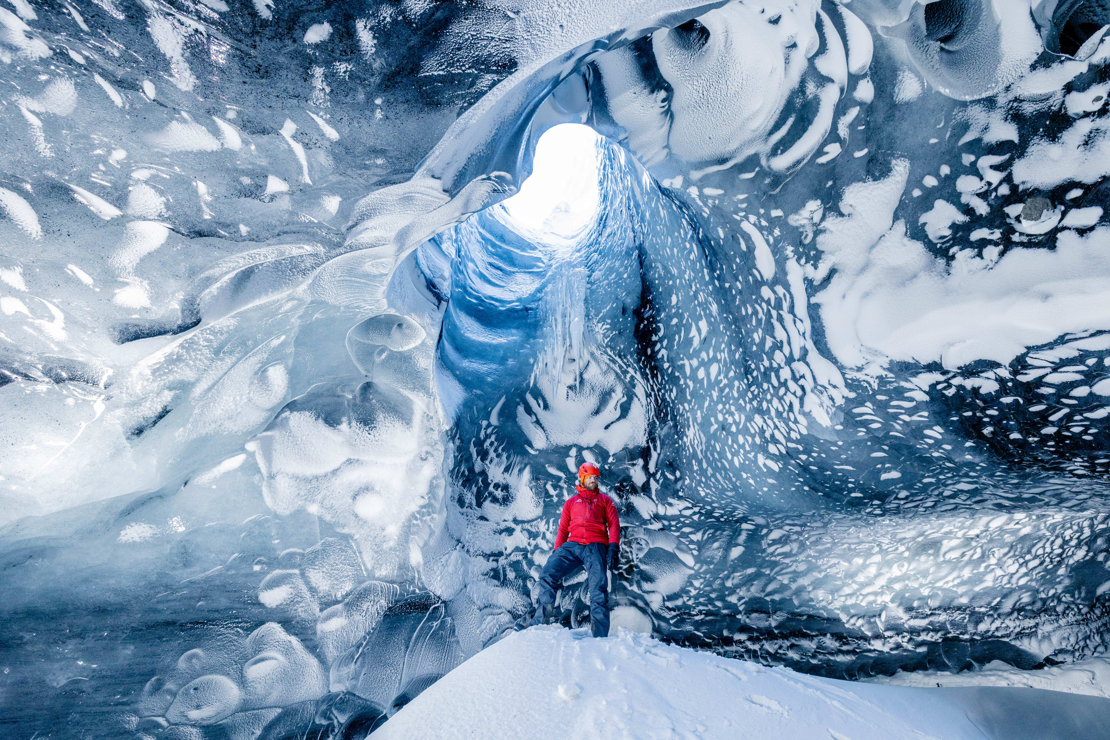man exploring Myrdalsjokull ice cave