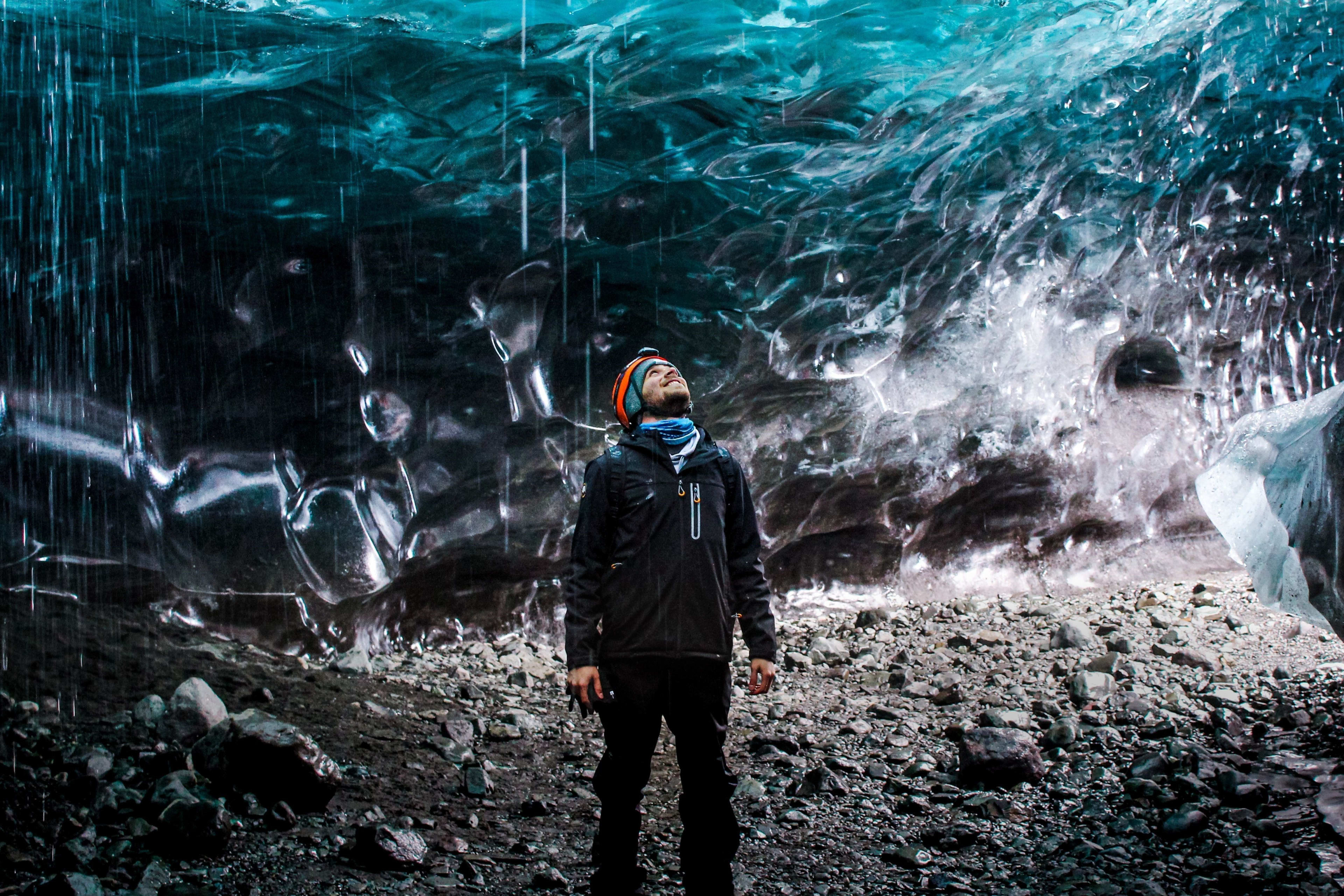 people staring at the blue ice cave