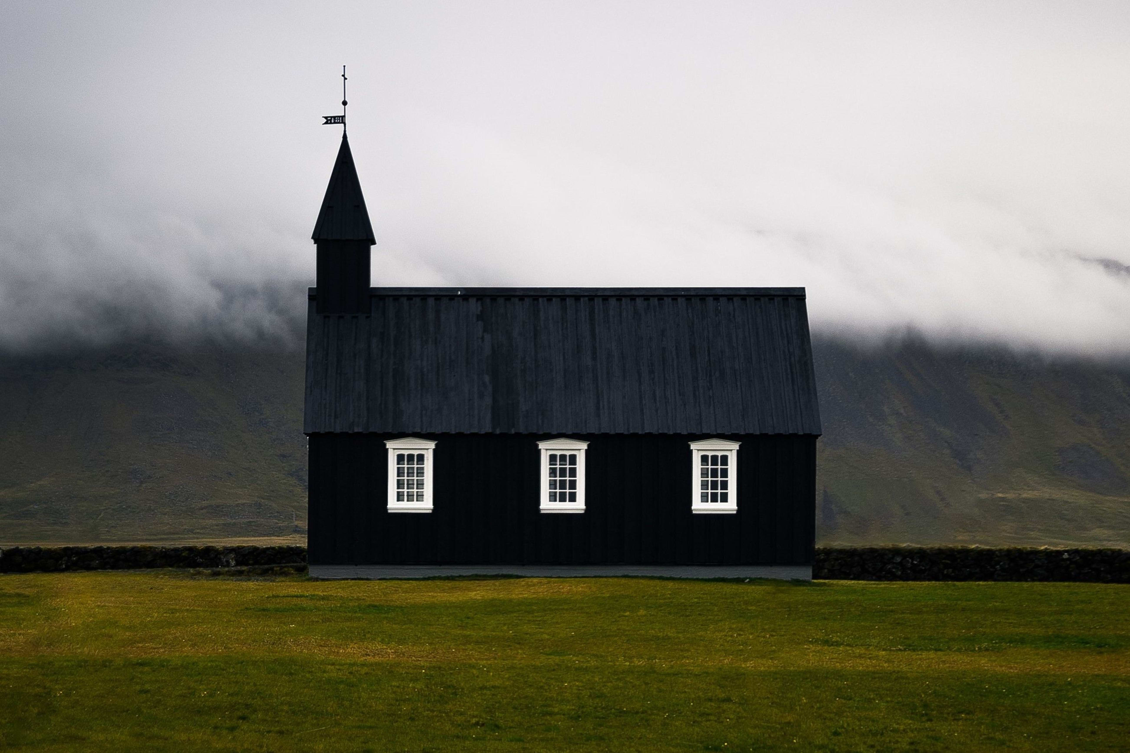 naefellsnes black church in foggy day