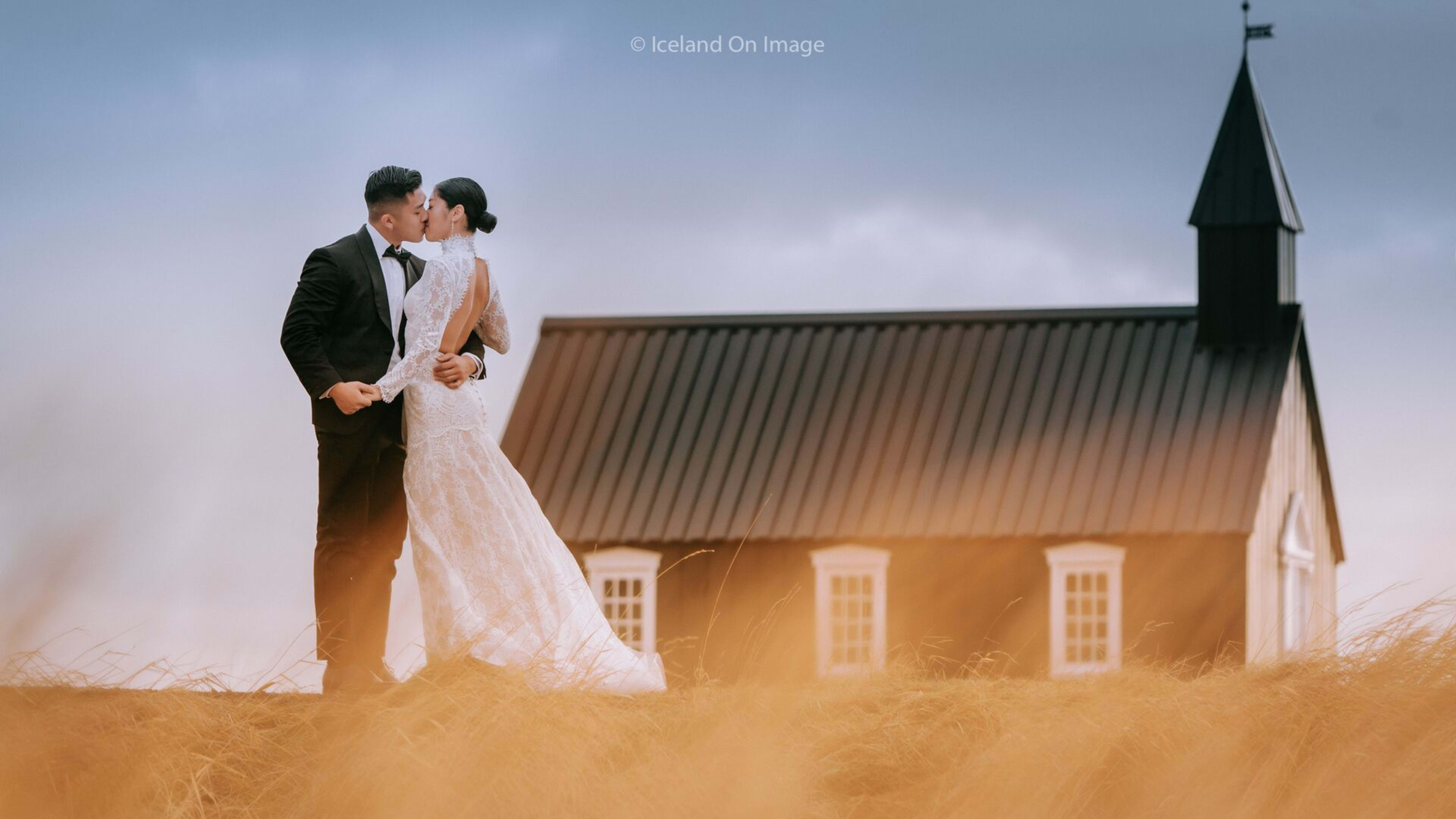 wedding couple kiss at budir black church