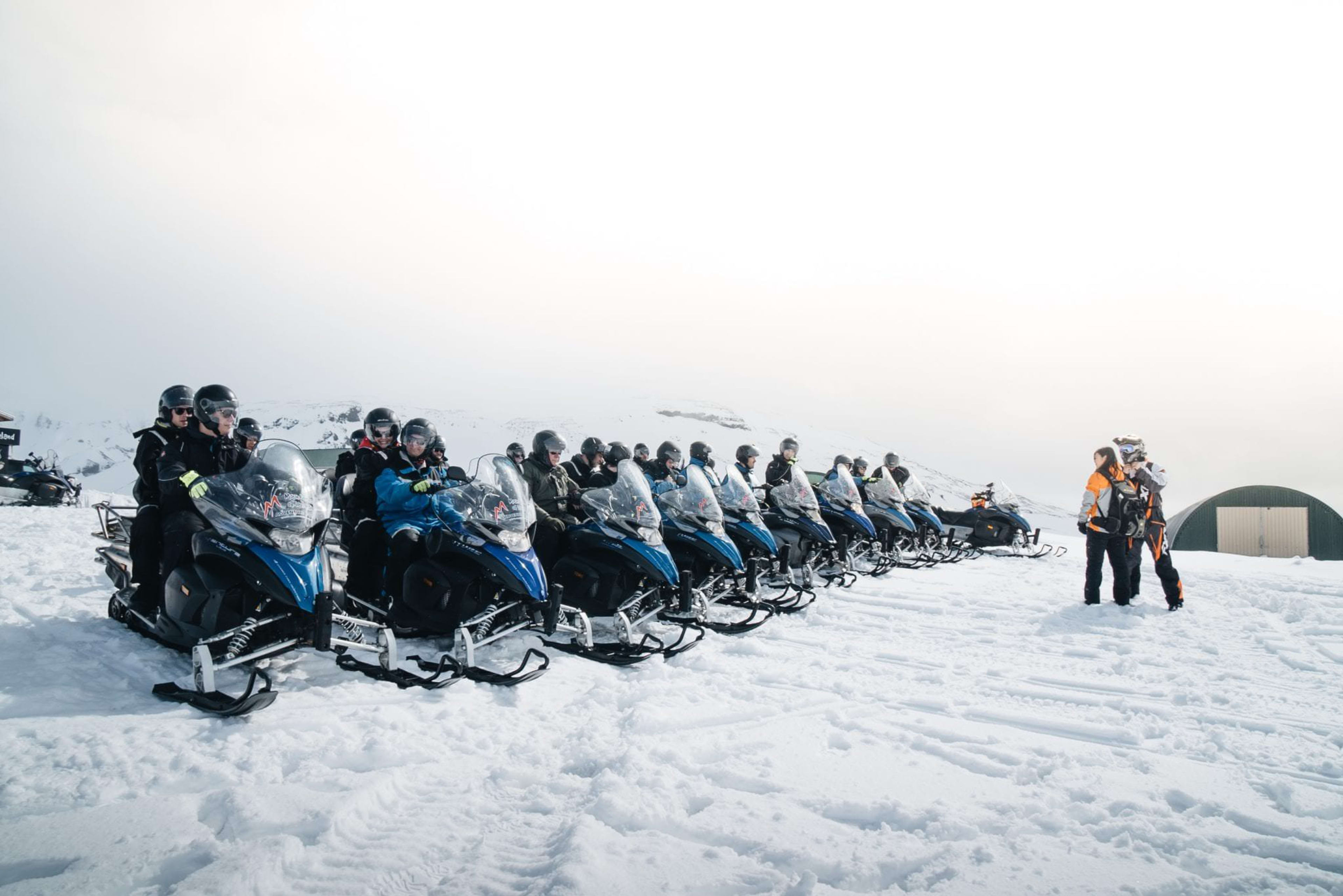 snowmobiles about to depart