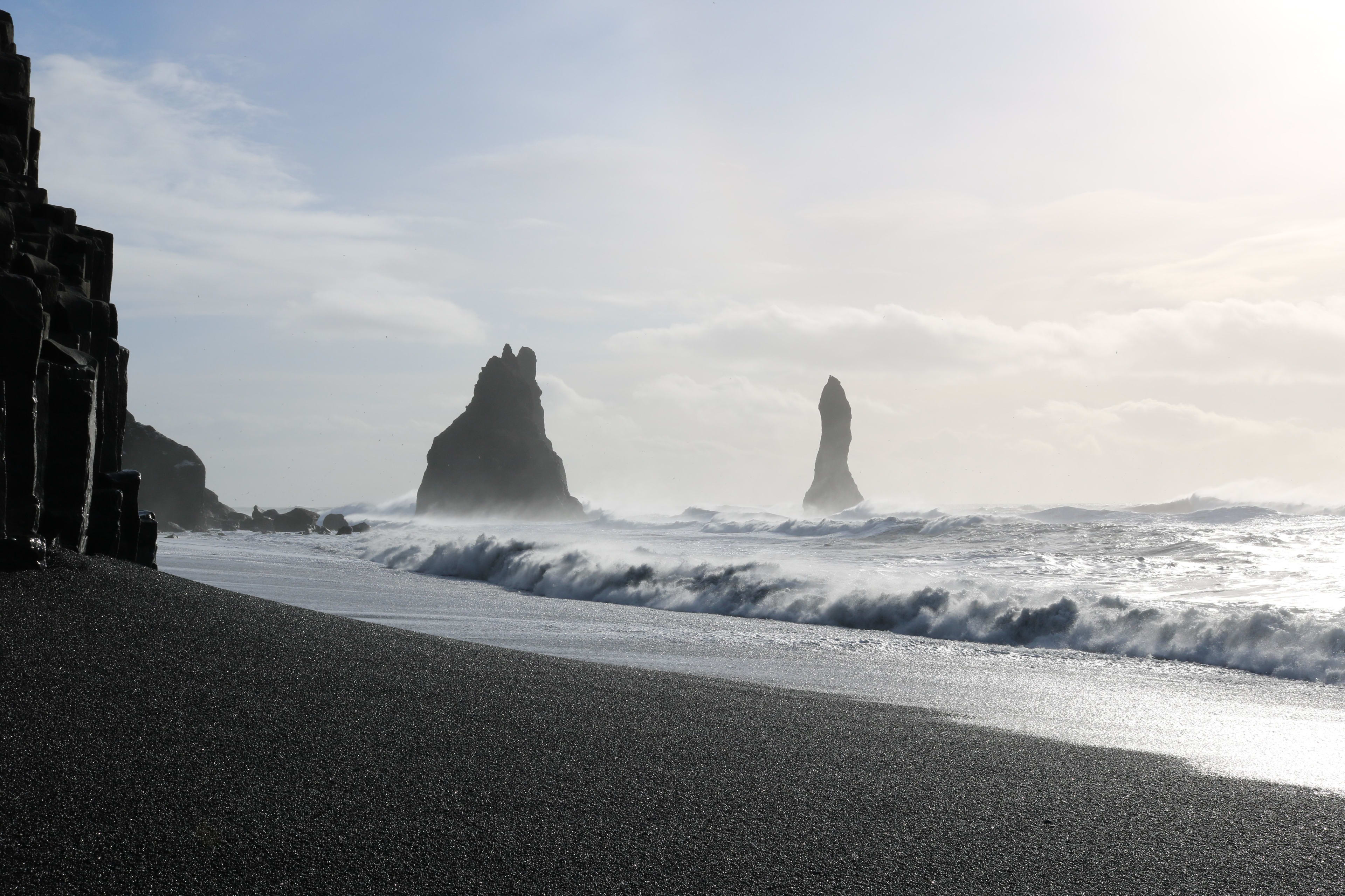 Reynisdrangar and pacific ocean with sunlight