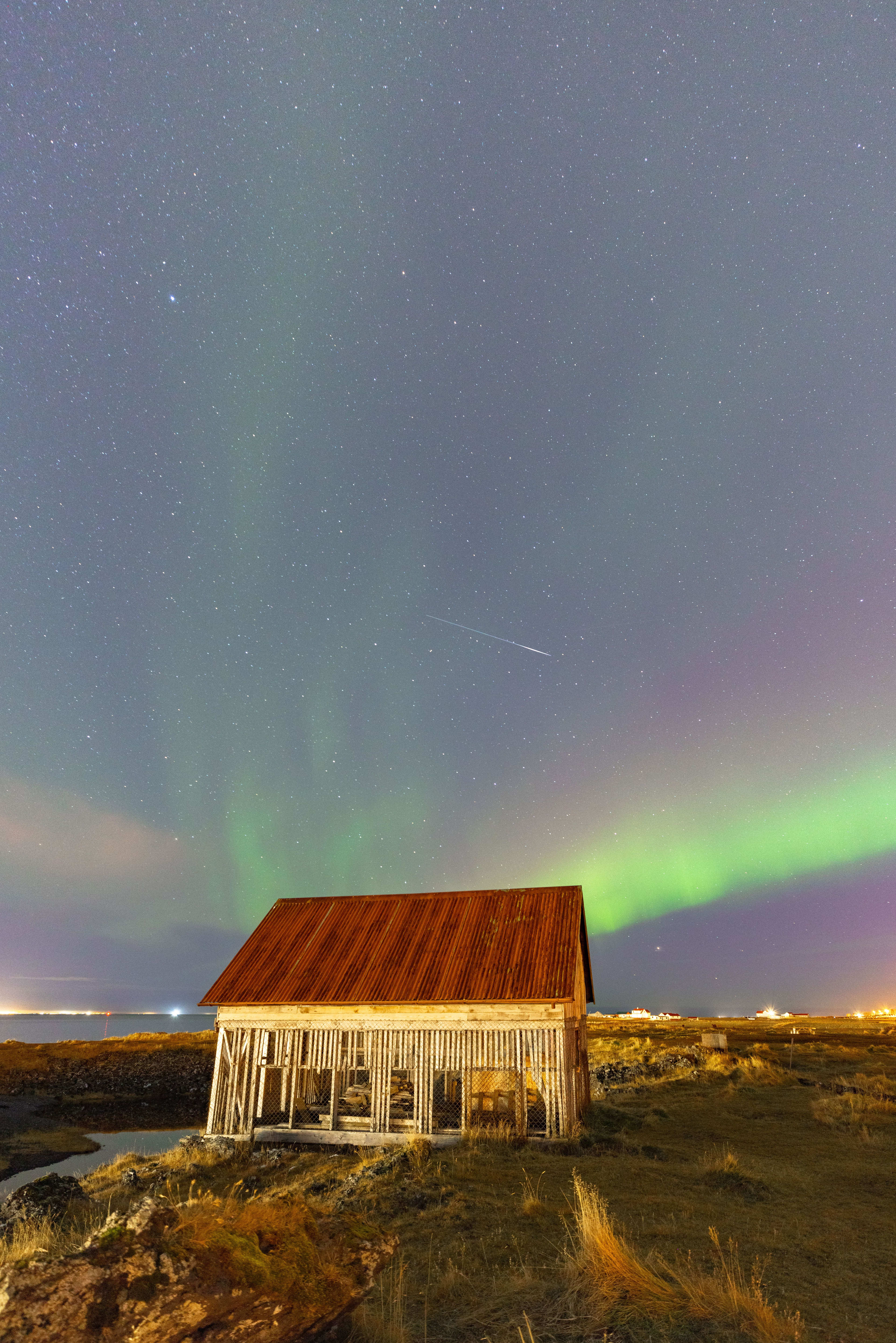 icelandic house with aurora borealis