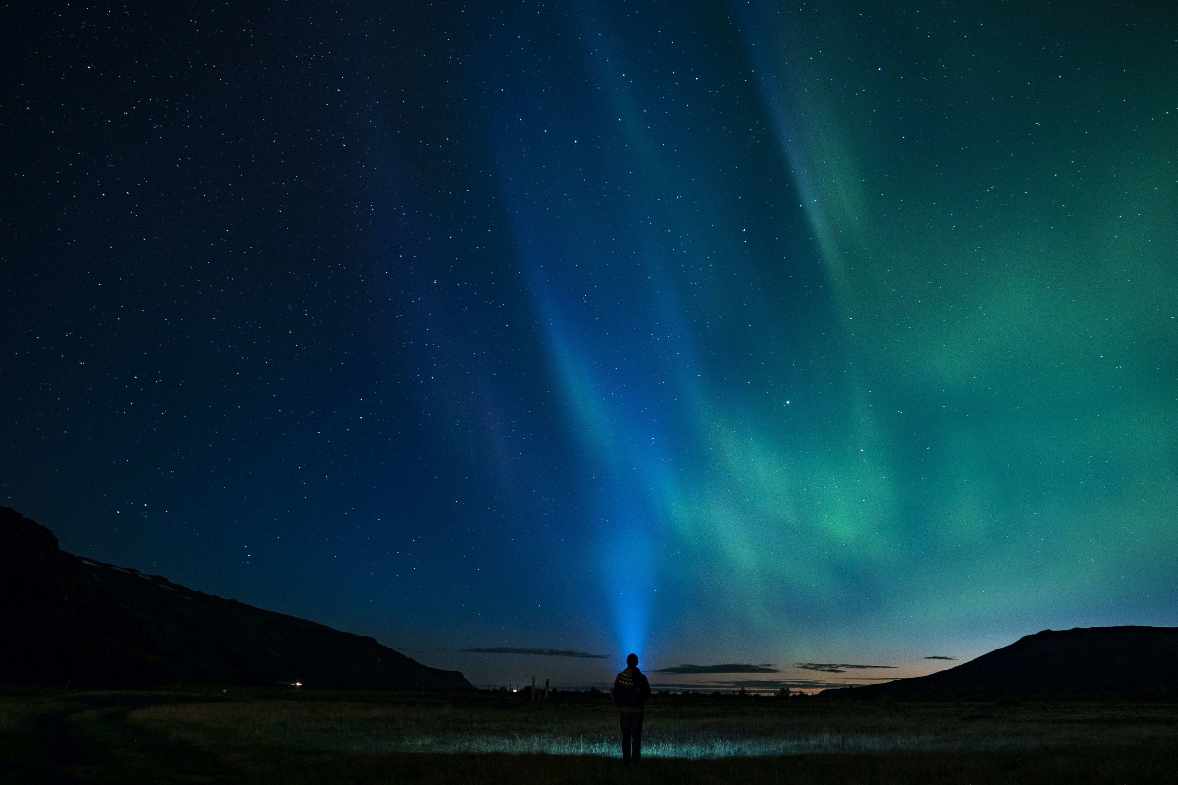 blue and green northern lights in iceland