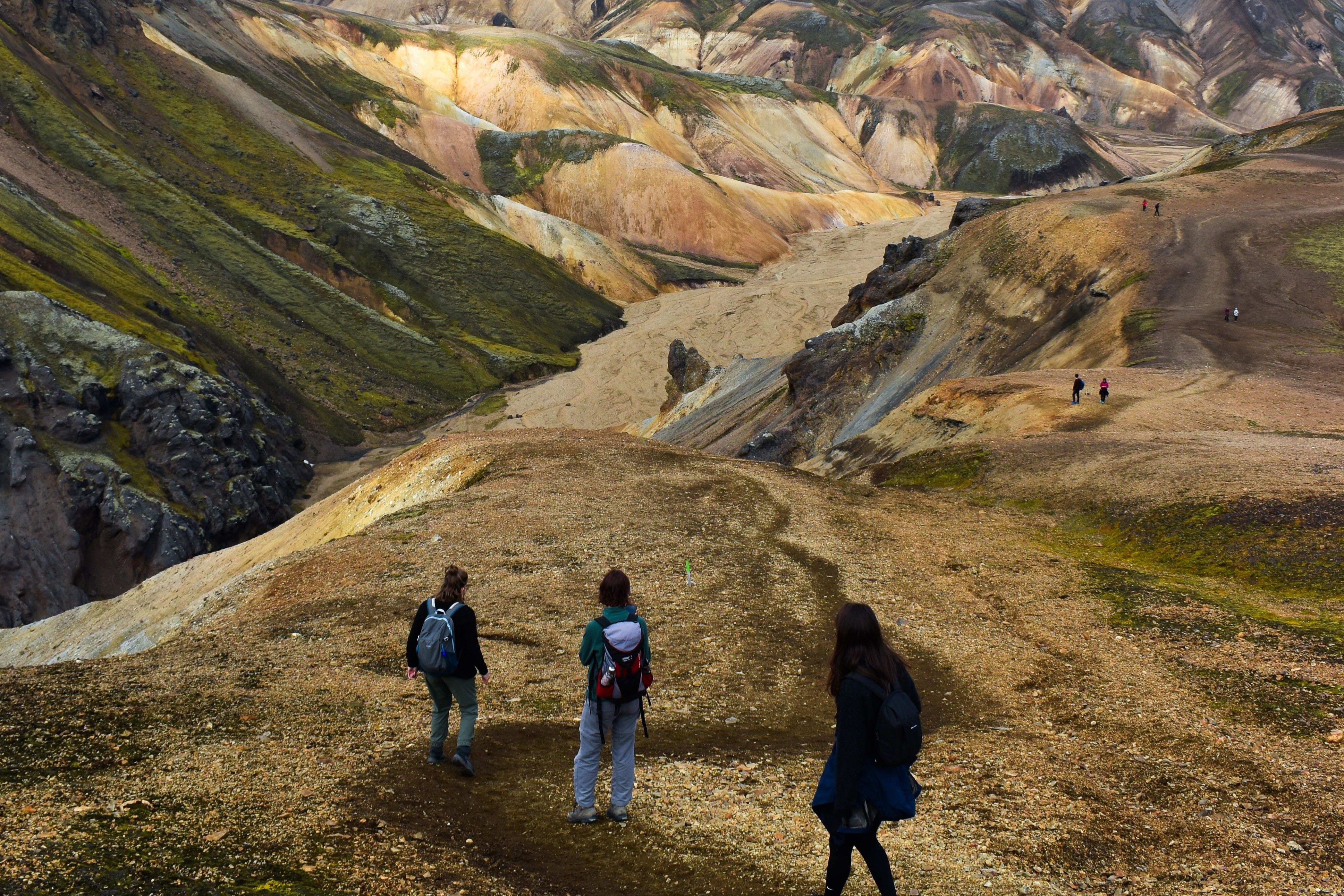 three people trekking in iceland highlands