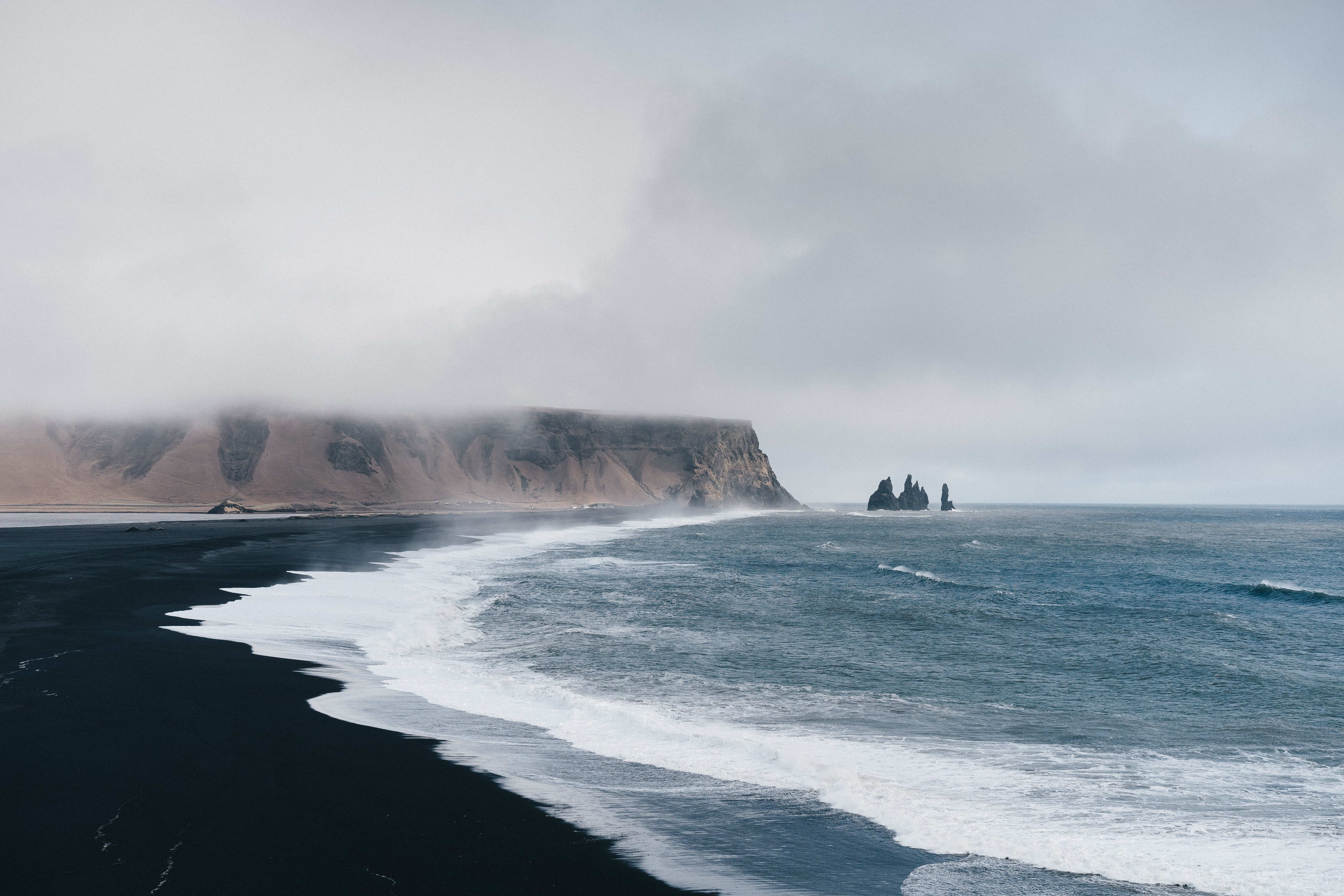 pacific ocean waves and the black sand beach