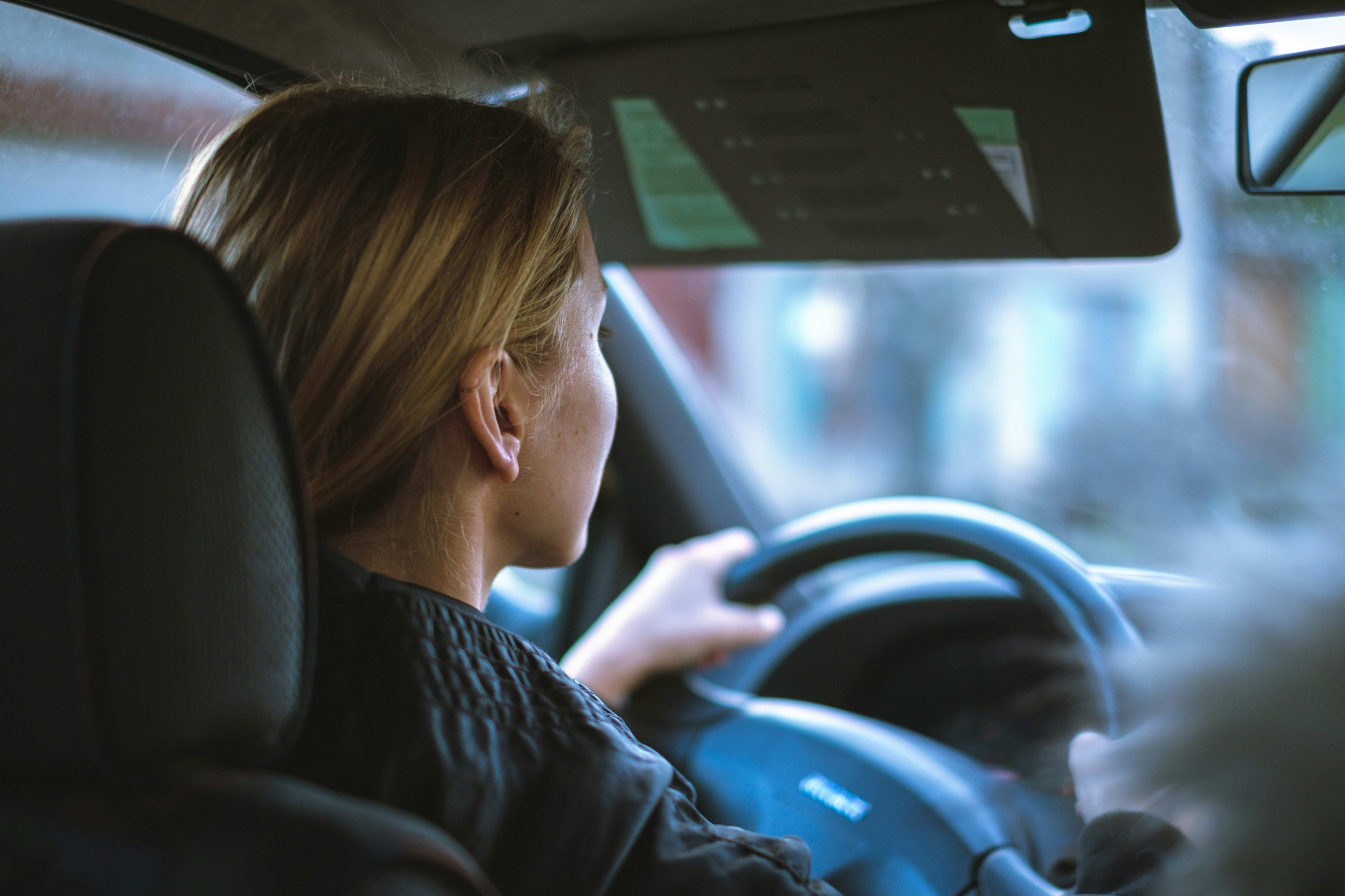woman driving on the road