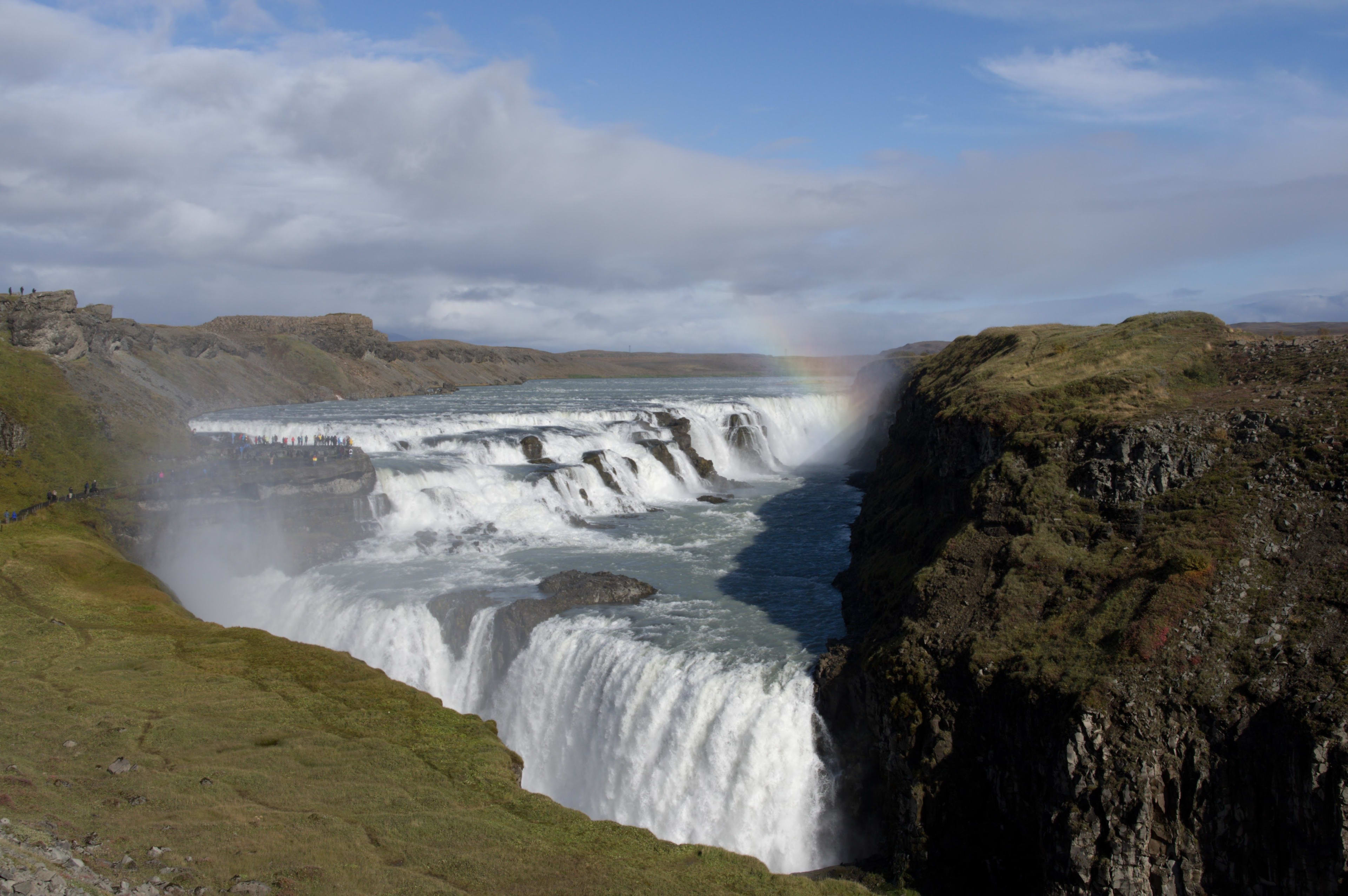 gullfoss with rainbow between canyon