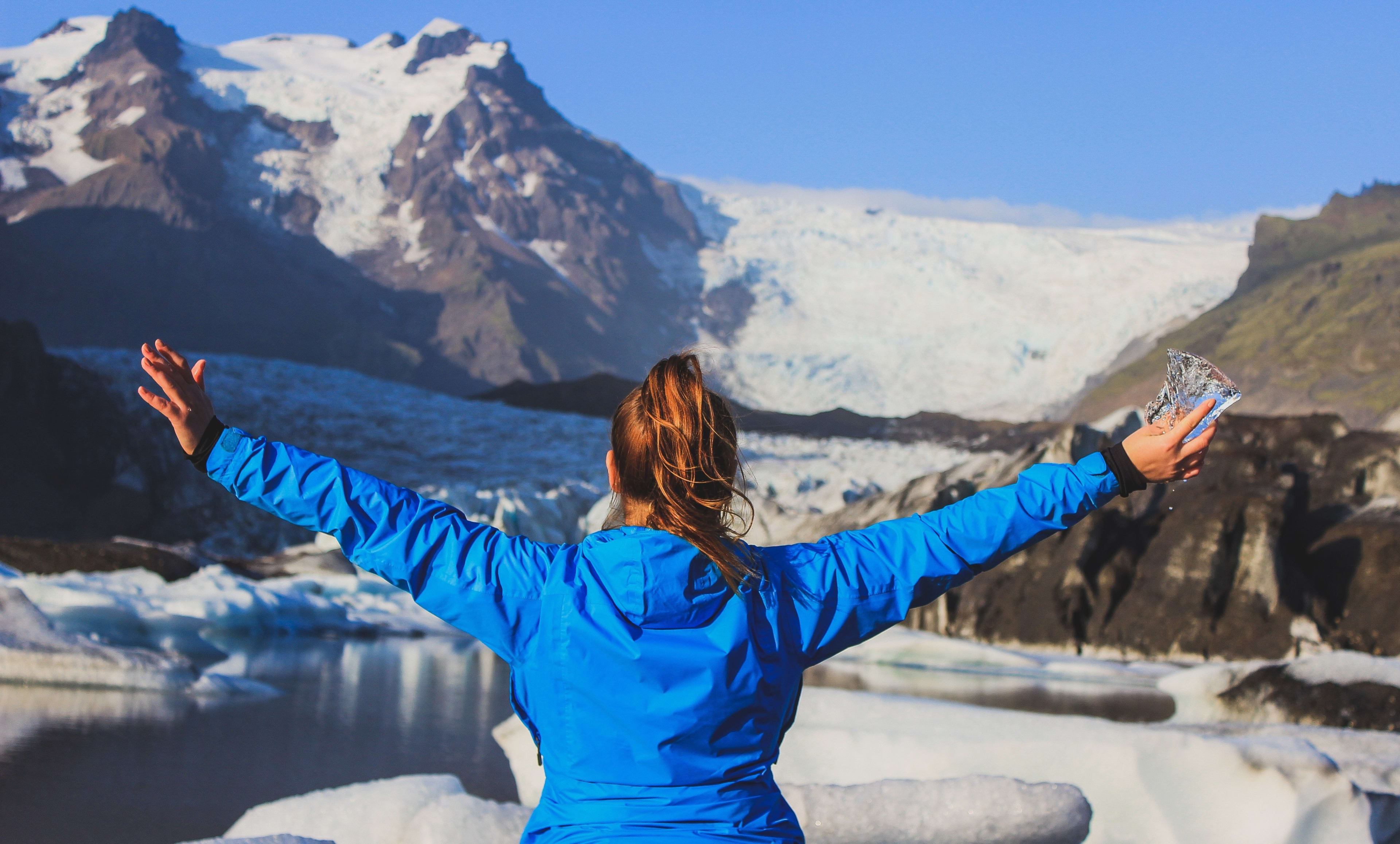 women in front of the glacier