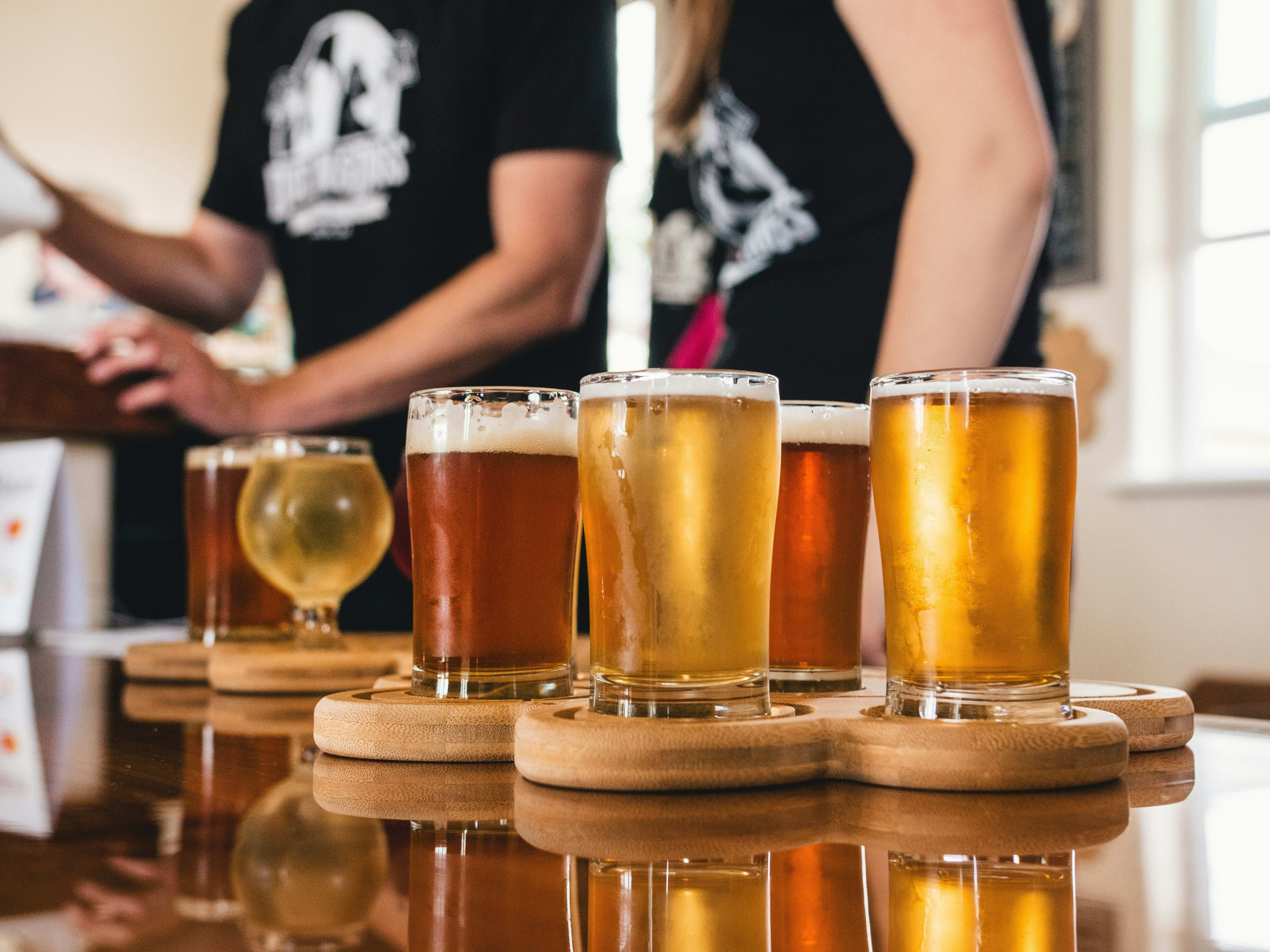 multiple mugs of beer