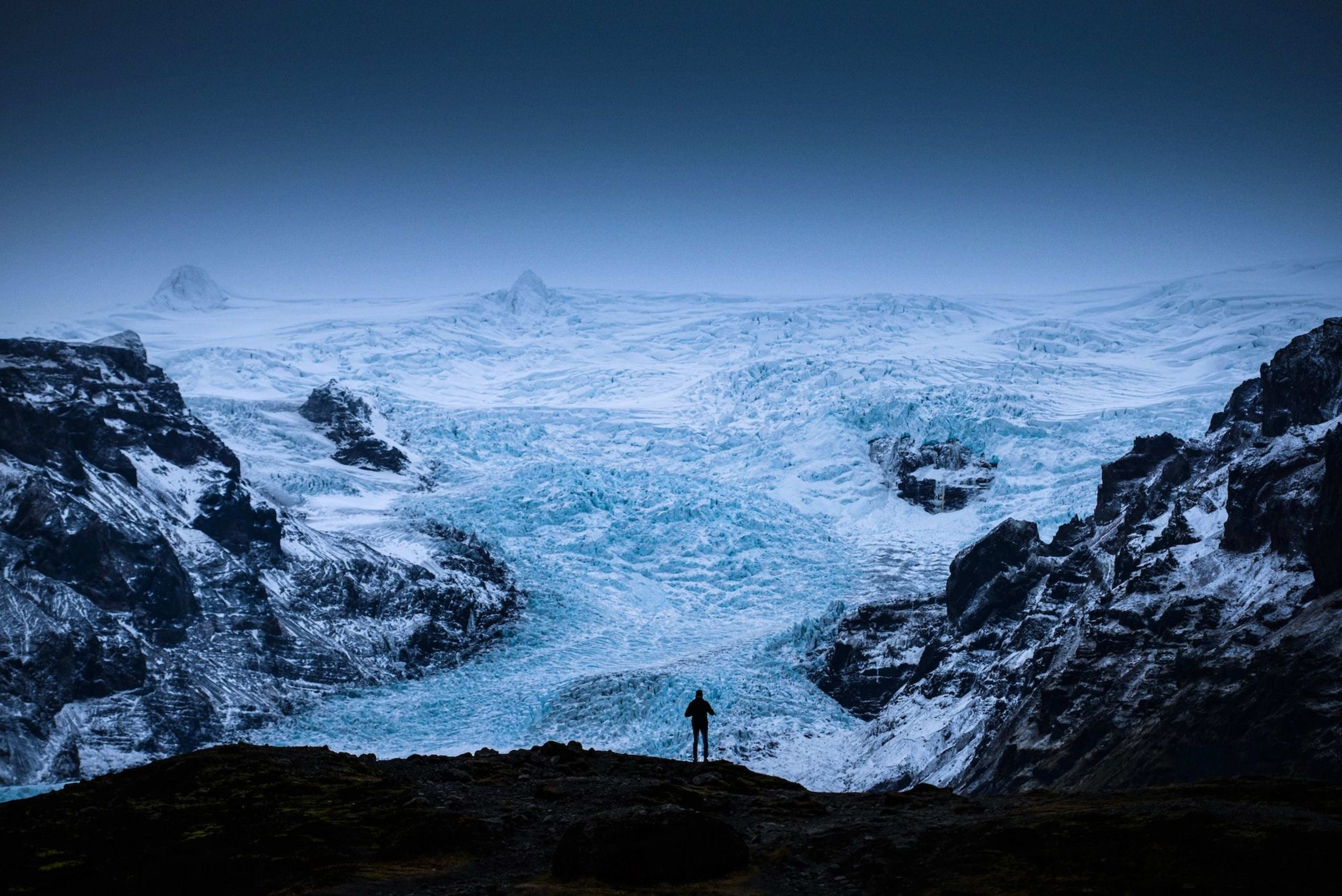 people taking pictures at iceland glacier