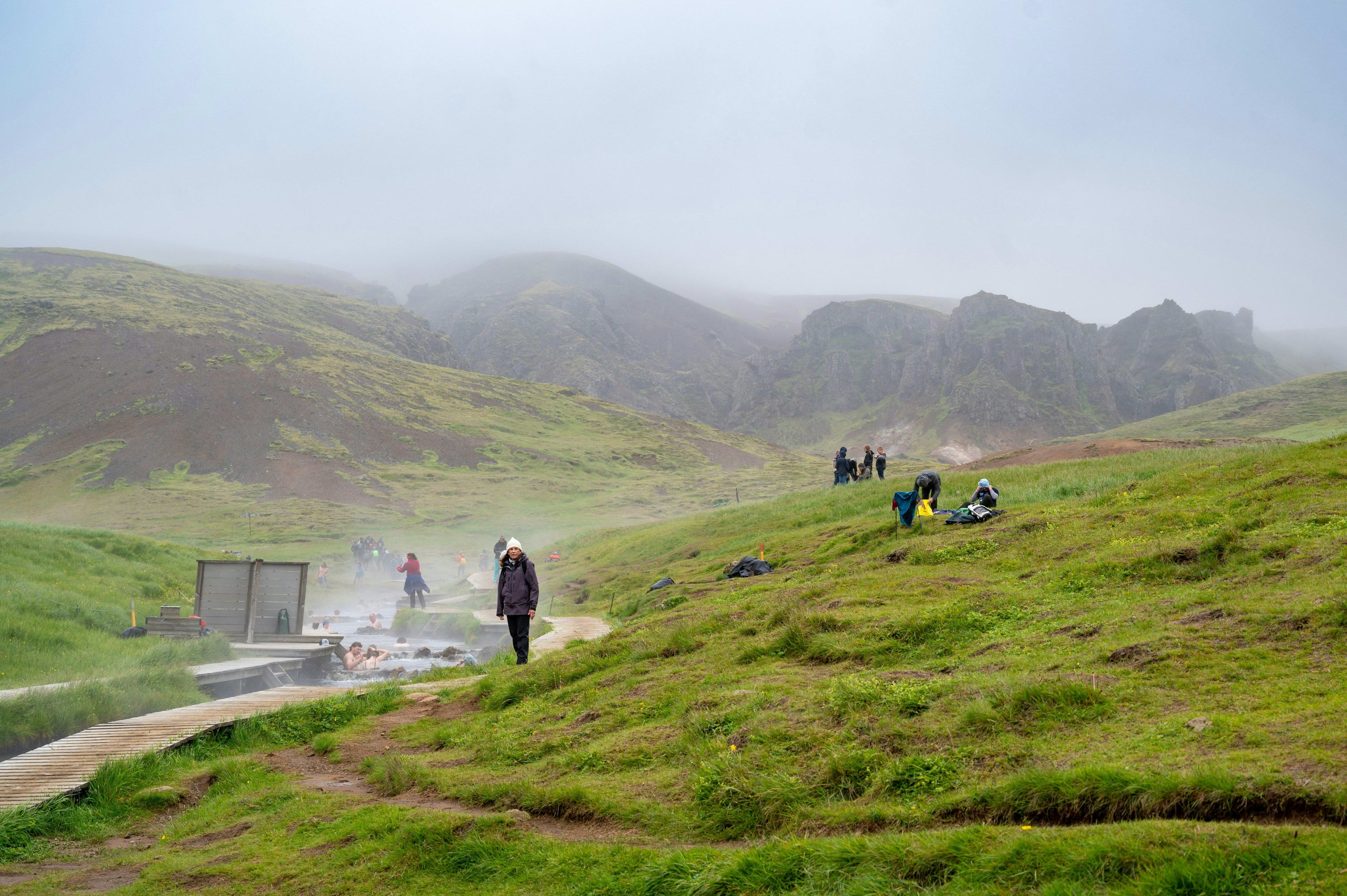 people in reykjadalur steam