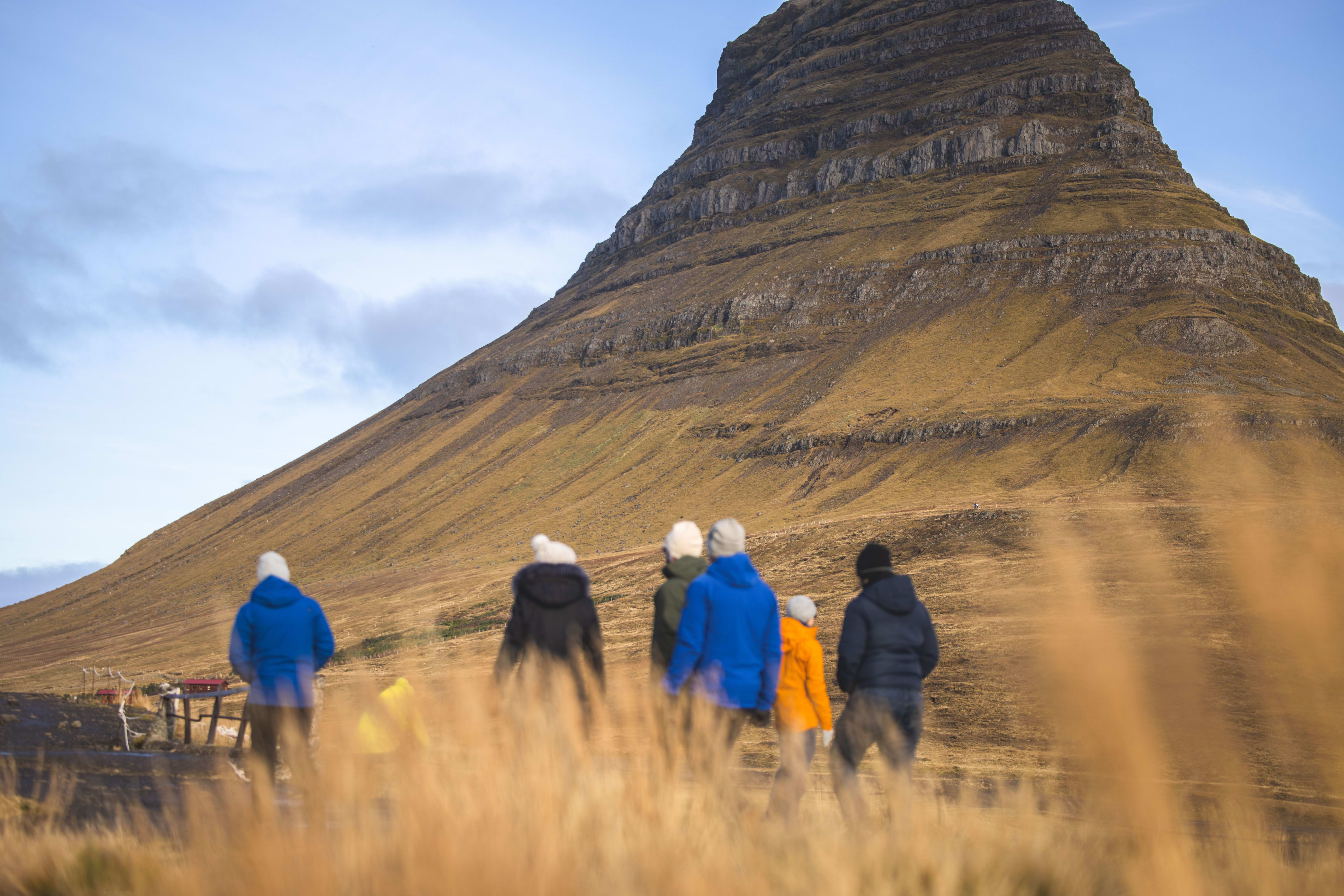 people visiting the kirkjufell mountain