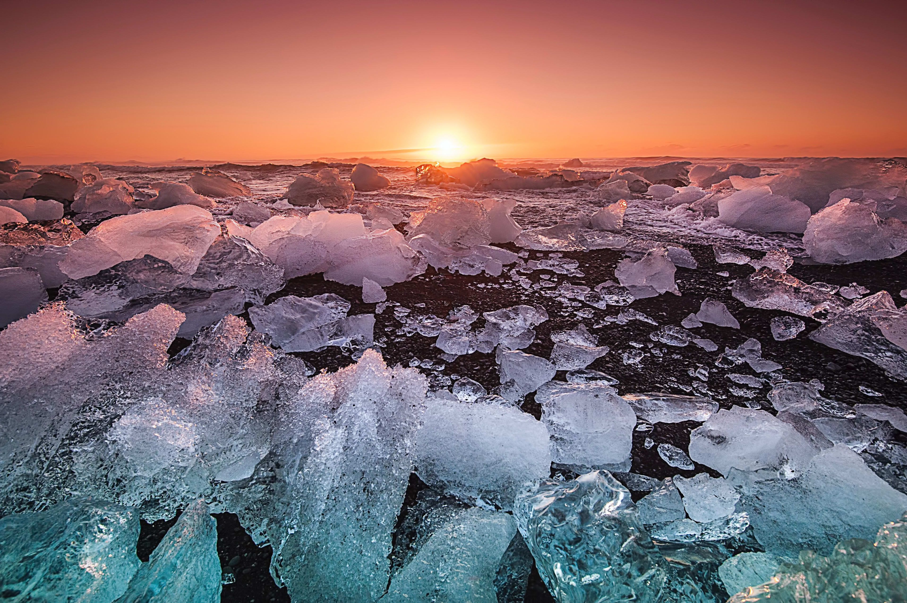 multiple ice on the diamond beach at sunset