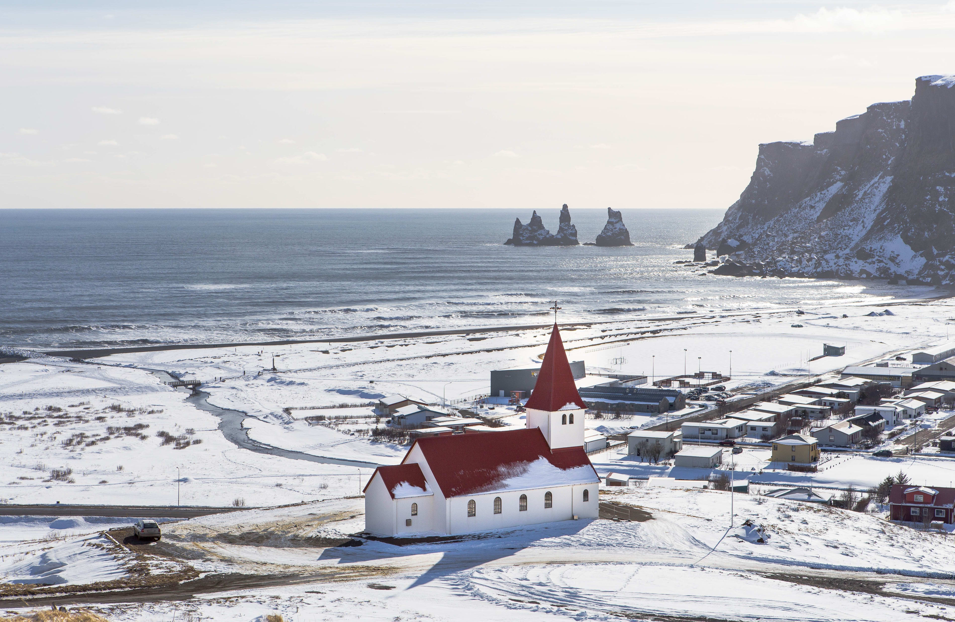 vik town and its red church in winter